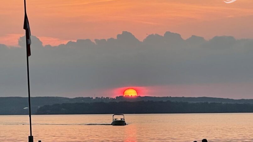 kids on docks and sunset at Adventure Bay Cottages